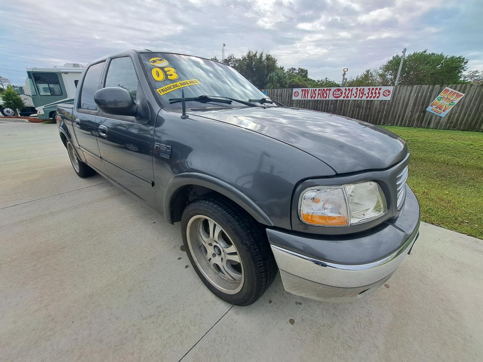 2003 Grey Ford F-150 King Ranch SuperCrew 2WD (1FTRW07L73K) with an 5.4L V8 SOHC 16V engine, 4-Speed Automatic Overdrive transmission, located at 1181 Aurora Rd, Melbourne, FL, 32935, (321) 241-1100, 28.132914, -80.639175 - Photo #2