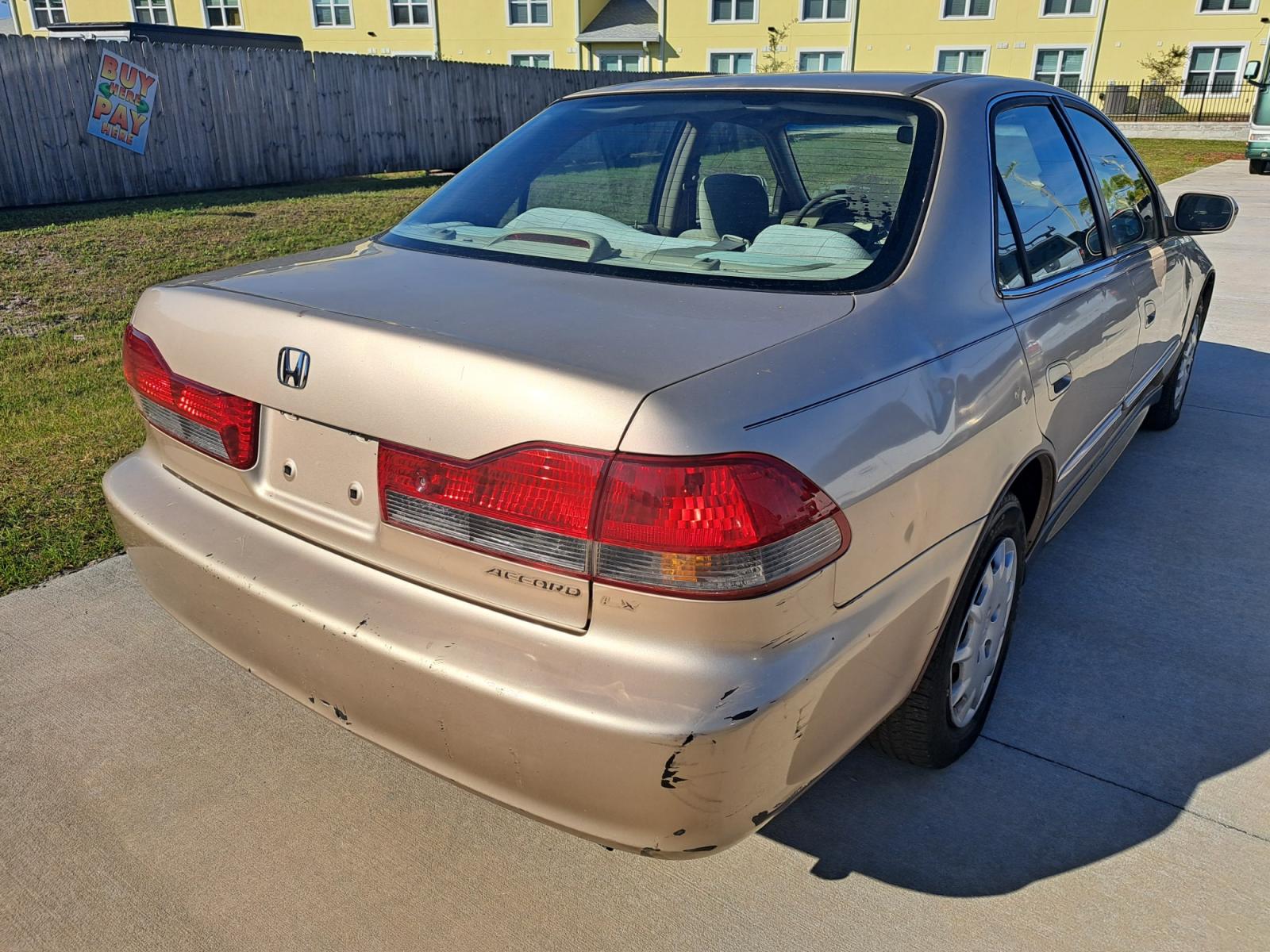 2001 Gold Honda Accord LX sedan (1HGCG56461A) with an 2.3L L4 SOHC 16V engine, 4-Speed Automatic Overdrive transmission, located at 1181 Aurora Rd, Melbourne, FL, 32935, (321) 241-1100, 28.132914, -80.639175 - Photo #1