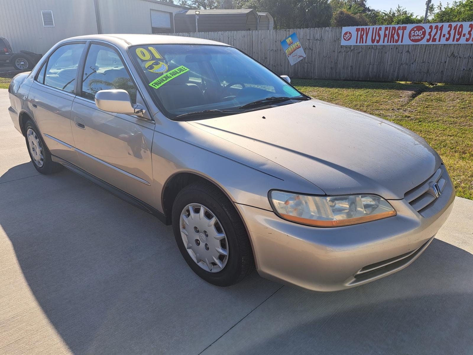 2001 Gold Honda Accord LX sedan (1HGCG56461A) with an 2.3L L4 SOHC 16V engine, 4-Speed Automatic Overdrive transmission, located at 1181 Aurora Rd, Melbourne, FL, 32935, (321) 241-1100, 28.132914, -80.639175 - Photo #2