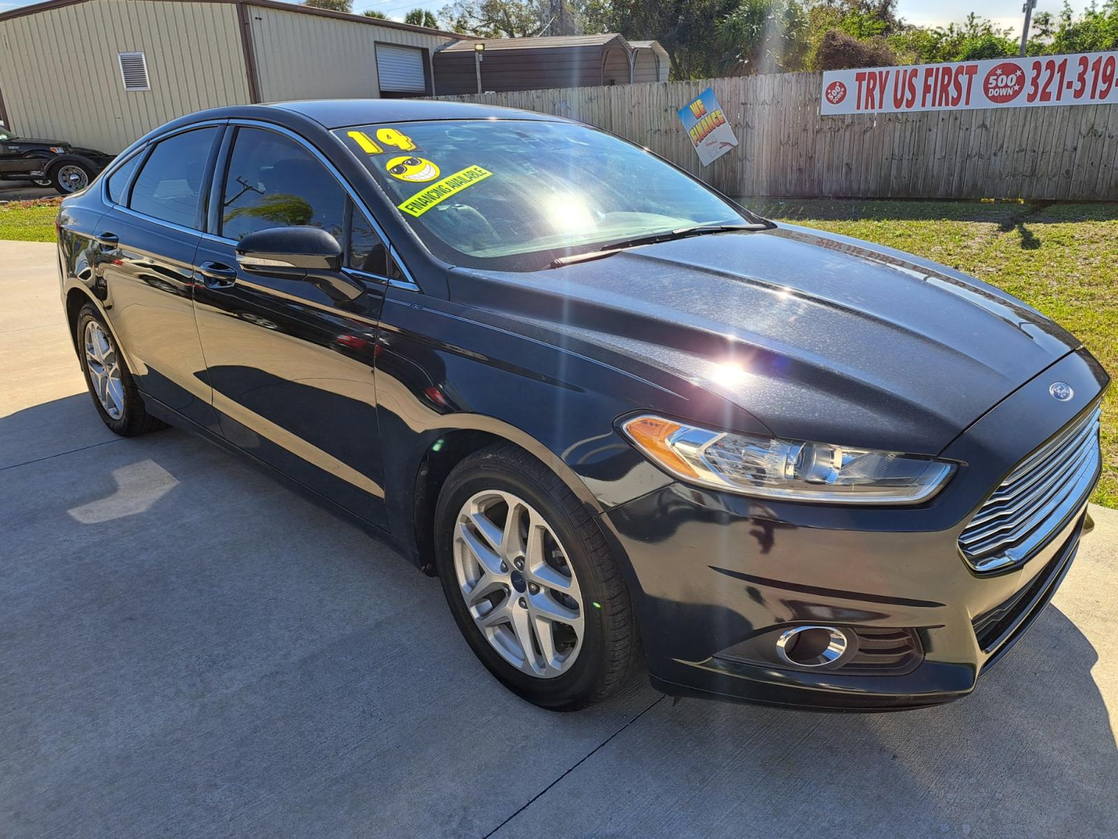 2014 Grey Ford Fusion SE (3FA6P0HD7ER) with an 1.5L L4 DOHC 16V engine, Automatic transmission, located at 1181 Aurora Rd, Melbourne, FL, 32935, (321) 241-1100, 28.132914, -80.639175 - Photo #2