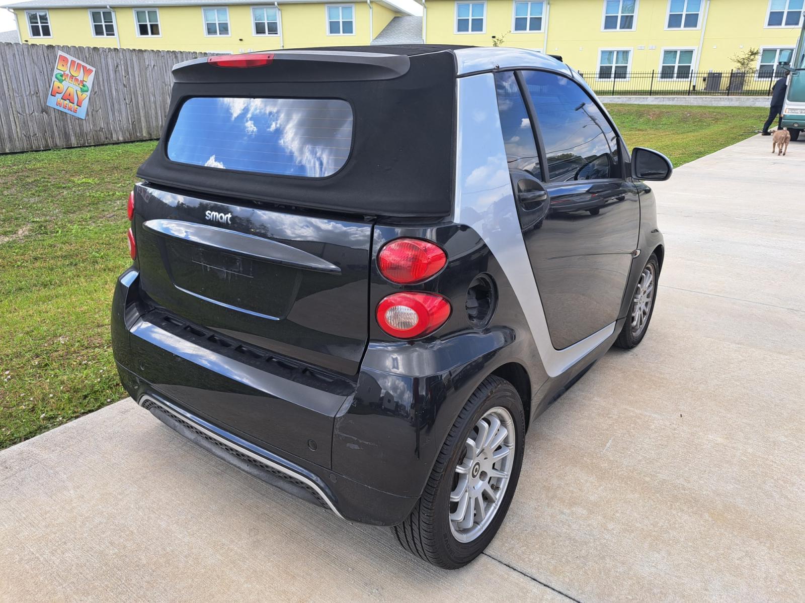 2013 Black smart Fortwo passion cabriolet (WMEEK3BA8DK) with an 1.0L L3 DOHC 12V engine, 5-Speed Automatic transmission, located at 1181 Aurora Rd, Melbourne, FL, 32935, (321) 241-1100, 28.132914, -80.639175 - Photo #1