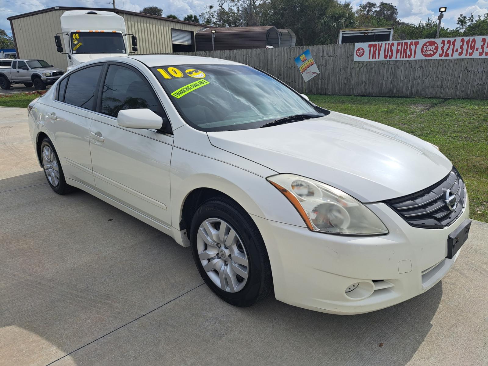 2010 White Nissan Altima 2.5 (1N4AL2AP0AN) with an 2.5L L4 DOHC 16V engine, Automatic transmission, located at 1181 Aurora Rd, Melbourne, FL, 32935, (321) 241-1100, 28.132914, -80.639175 - Photo #2