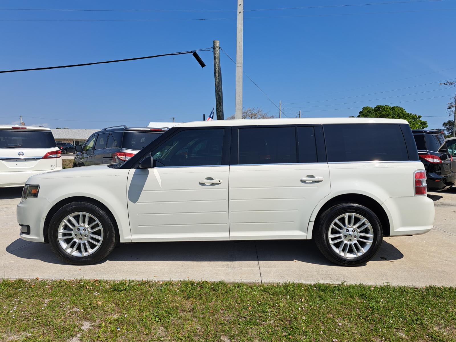 2014 White Ford Flex SEL FWD (2FMGK5C85EB) with an 3.5L V6 DOHC 24V engine, Automatic Overdrive transmission, located at 1181 Aurora Rd, Melbourne, FL, 32935, (321) 241-1100, 28.132914, -80.639175 - Photo #0