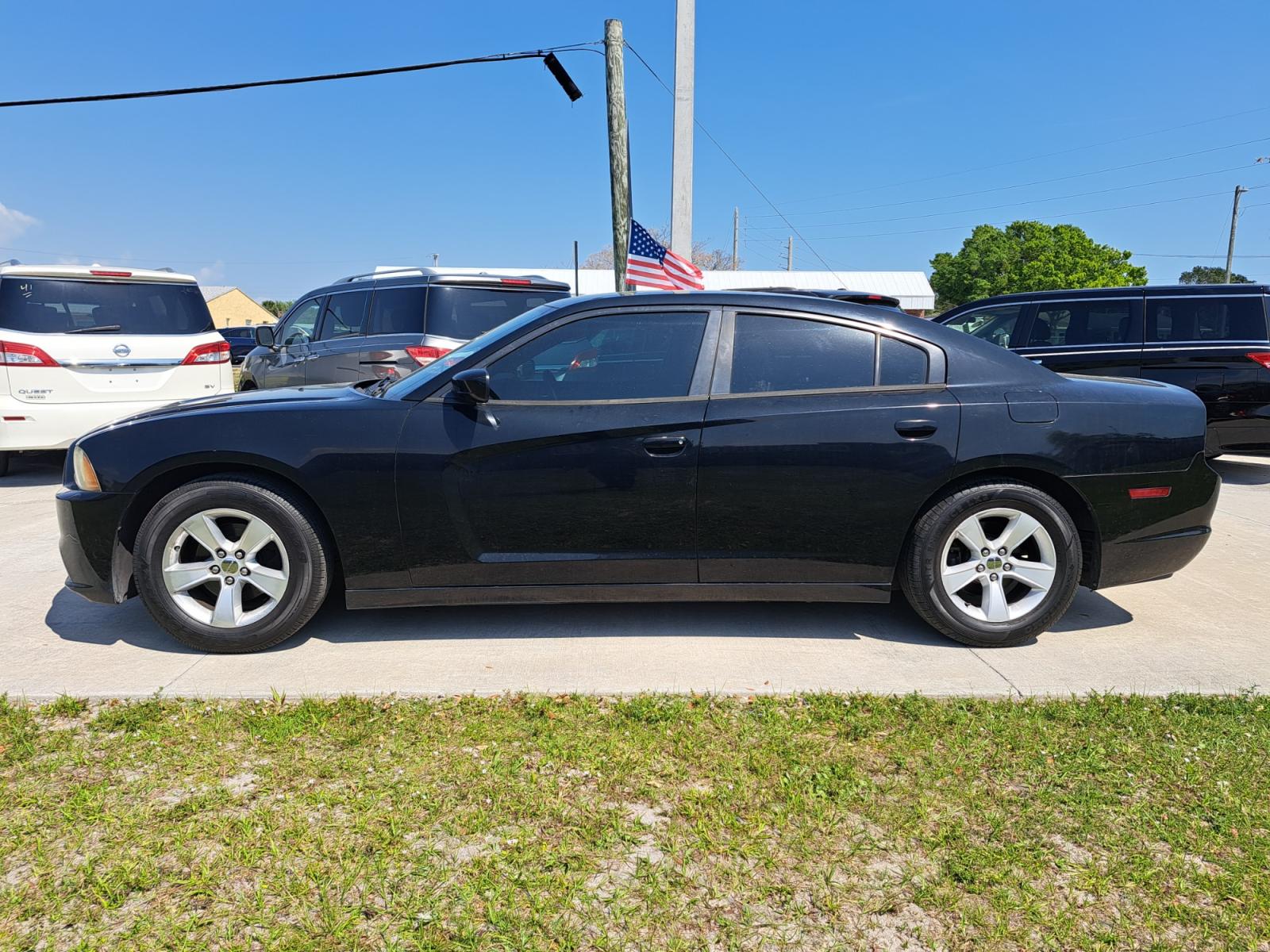 2012 Black Dodge Charger SE (2C3CDXBG1CH) with an 3.6L V6 DOHC 24V engine, Automatic transmission, located at 1181 Aurora Rd, Melbourne, FL, 32935, (321) 241-1100, 28.132914, -80.639175 - Photo #0