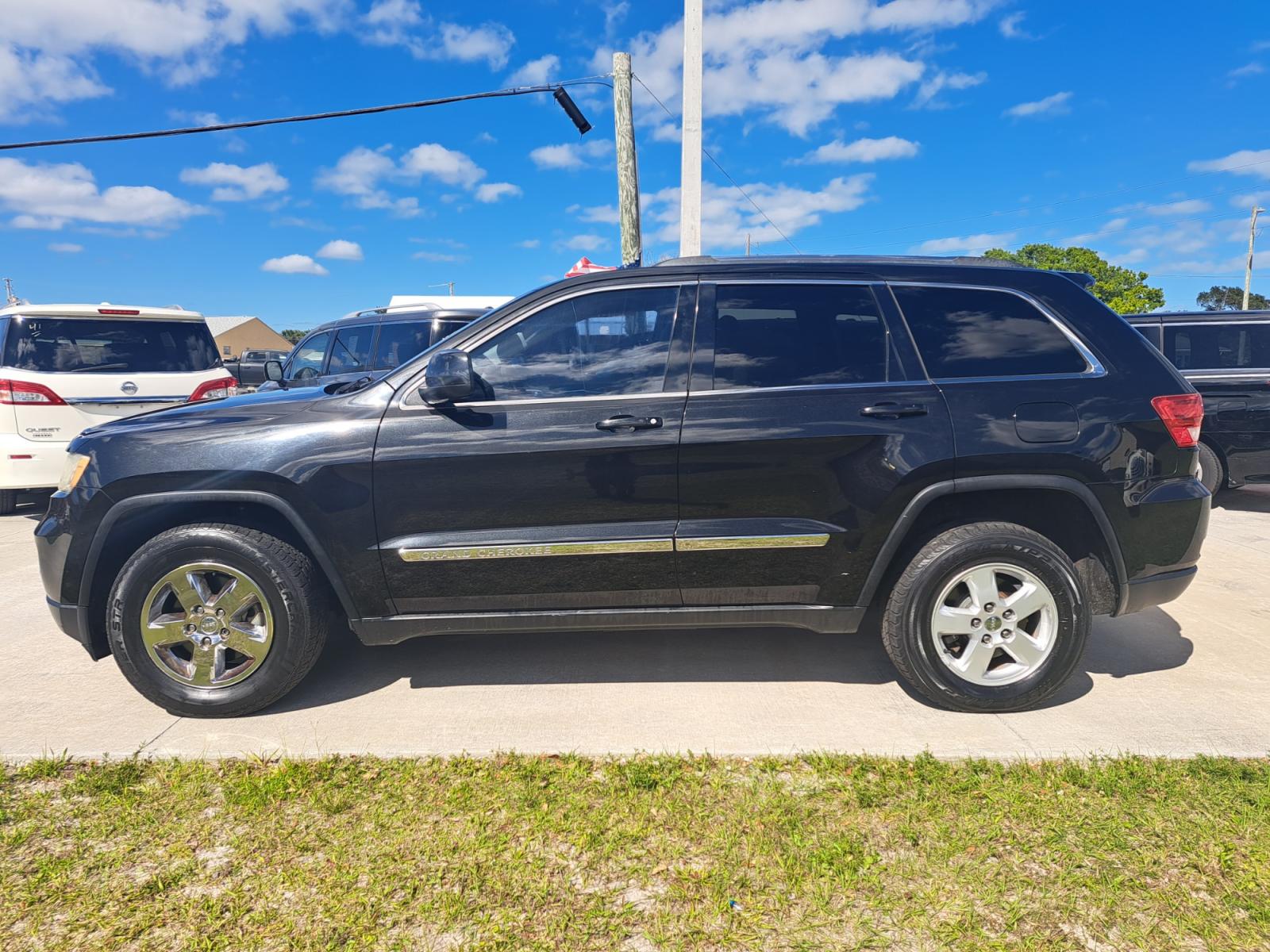 2013 Black Jeep Grand Cherokee Laredo 2WD (1C4RJEAG4DC) with an 3.6L V6 DOHC 24V engine, 5-Speed Automatic transmission, located at 1181 Aurora Rd, Melbourne, FL, 32935, (321) 241-1100, 28.132914, -80.639175 - Photo #0