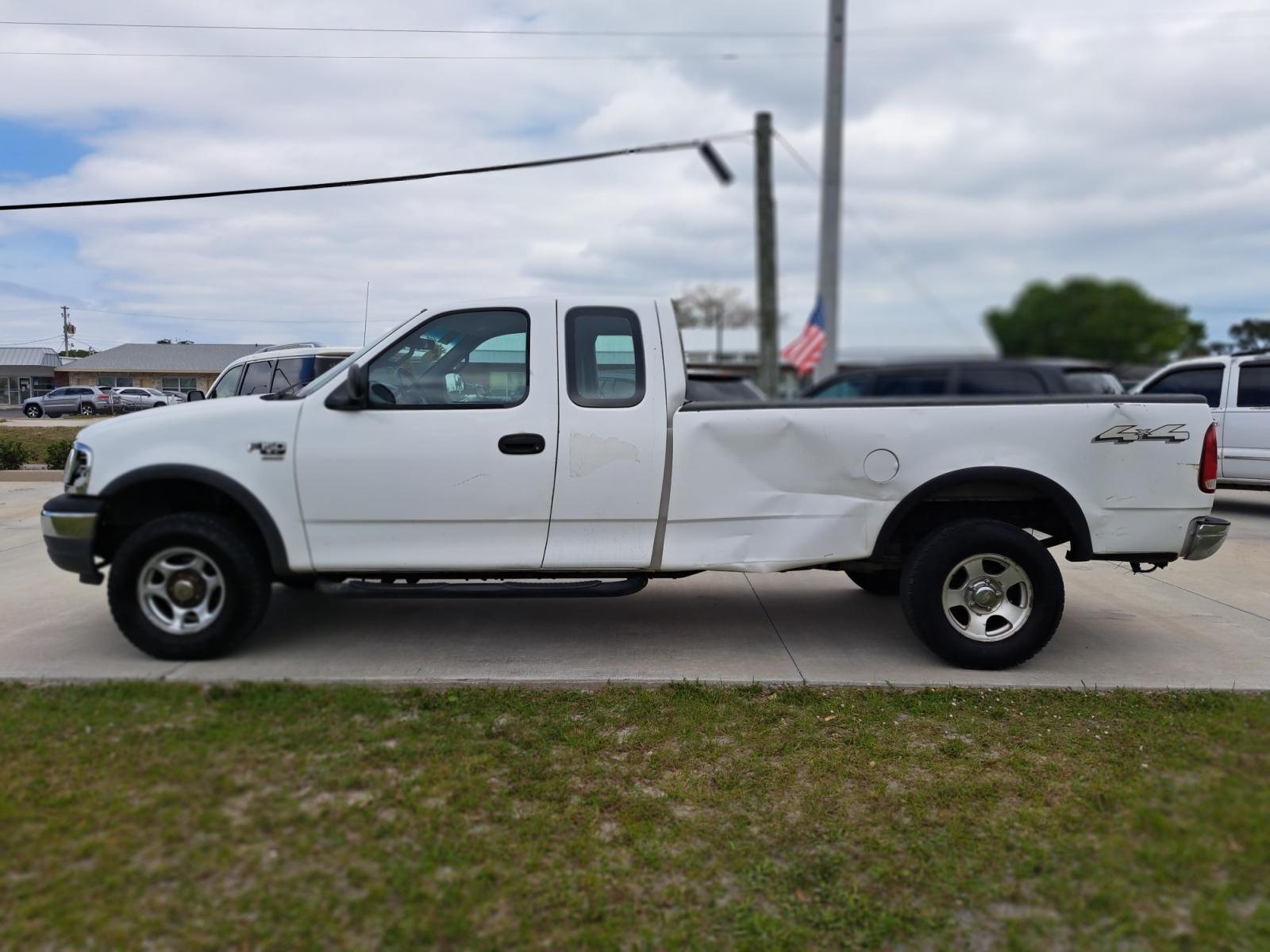 2001 White Ford F-150 Lariat SuperCab Long Bed 4WD (1FTRX18W41K) with an 4.6L V8 SOHC 16V engine, located at 1181 Aurora Rd, Melbourne, FL, 32935, (321) 241-1100, 28.132914, -80.639175 - Photo #0
