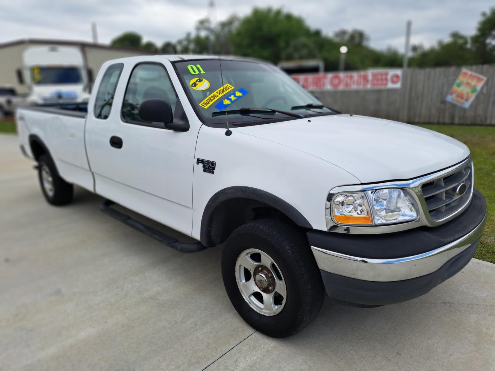 2001 White Ford F-150 Lariat SuperCab Long Bed 4WD (1FTRX18W41K) with an 4.6L V8 SOHC 16V engine, located at 1181 Aurora Rd, Melbourne, FL, 32935, (321) 241-1100, 28.132914, -80.639175 - Photo #2