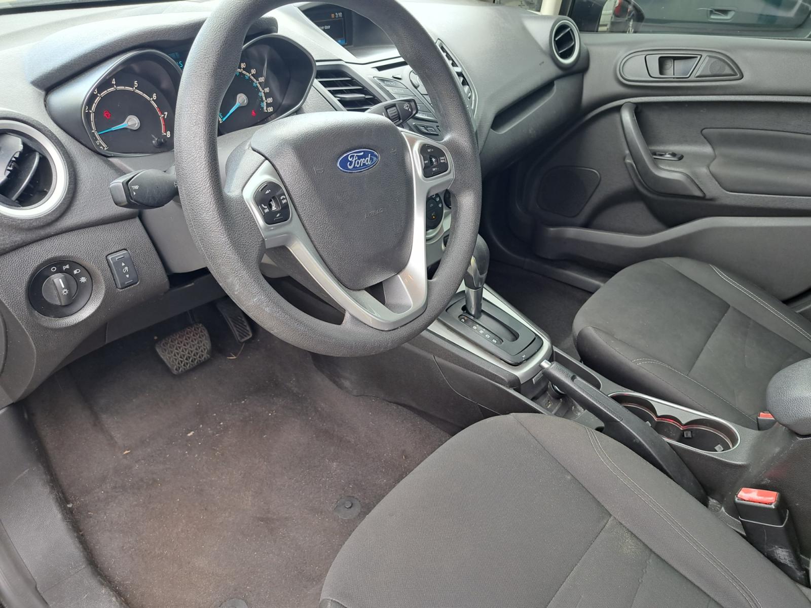 2018 Black Ford Fiesta SE Hatchback (3FADP4EJ9JM) with an 1.6L L4 DOHC 16V engine, Automatic transmission, located at 1181 Aurora Rd, Melbourne, FL, 32935, (321) 241-1100, 28.132914, -80.639175 - Photo #3