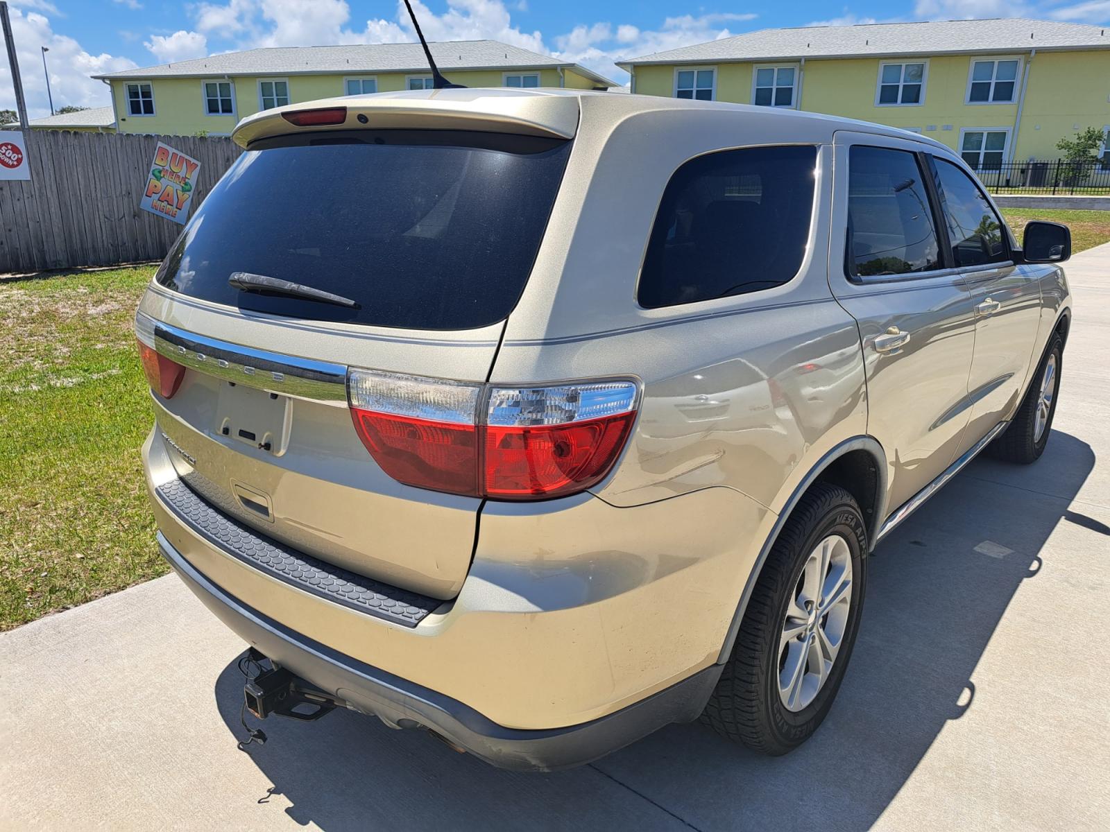 2011 Gold Dodge Durango Express 2WD (1D4RD2GG9BC) with an 3.6L V6 DOHC 24V engine, Automatic transmission, located at 1181 Aurora Rd, Melbourne, FL, 32935, (321) 241-1100, 28.132914, -80.639175 - Photo #1