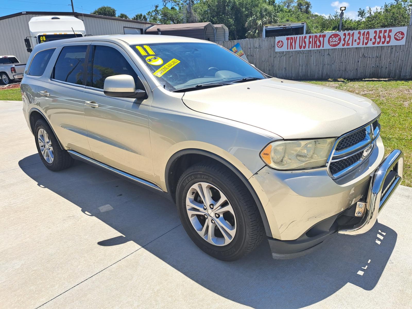 2011 Gold Dodge Durango Express 2WD (1D4RD2GG9BC) with an 3.6L V6 DOHC 24V engine, Automatic transmission, located at 1181 Aurora Rd, Melbourne, FL, 32935, (321) 241-1100, 28.132914, -80.639175 - Photo #2
