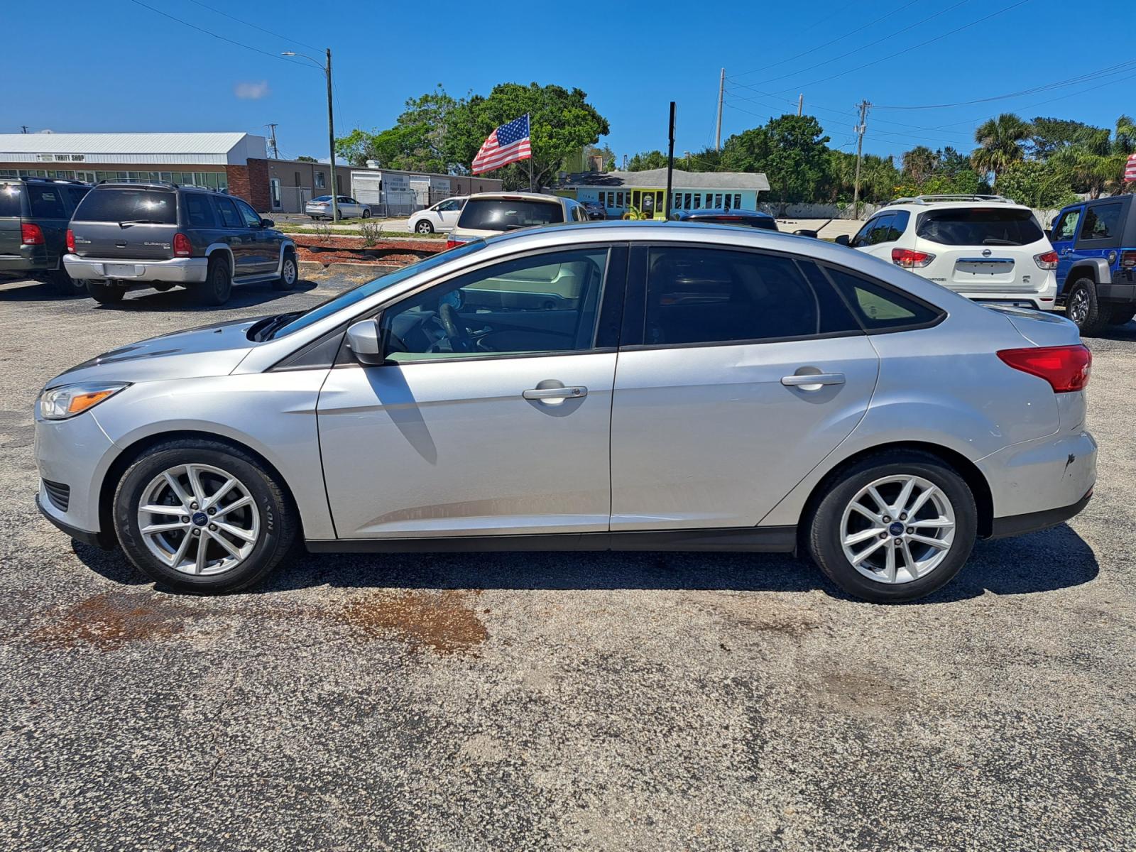 2018 Silver Ford Focus SE Sedan (1FADP3F27JL) with an 2.0L L4 DOHC 16V engine, Automatic transmission, located at 1181 Aurora Rd, Melbourne, FL, 32935, (321) 241-1100, 28.132914, -80.639175 - Photo #0