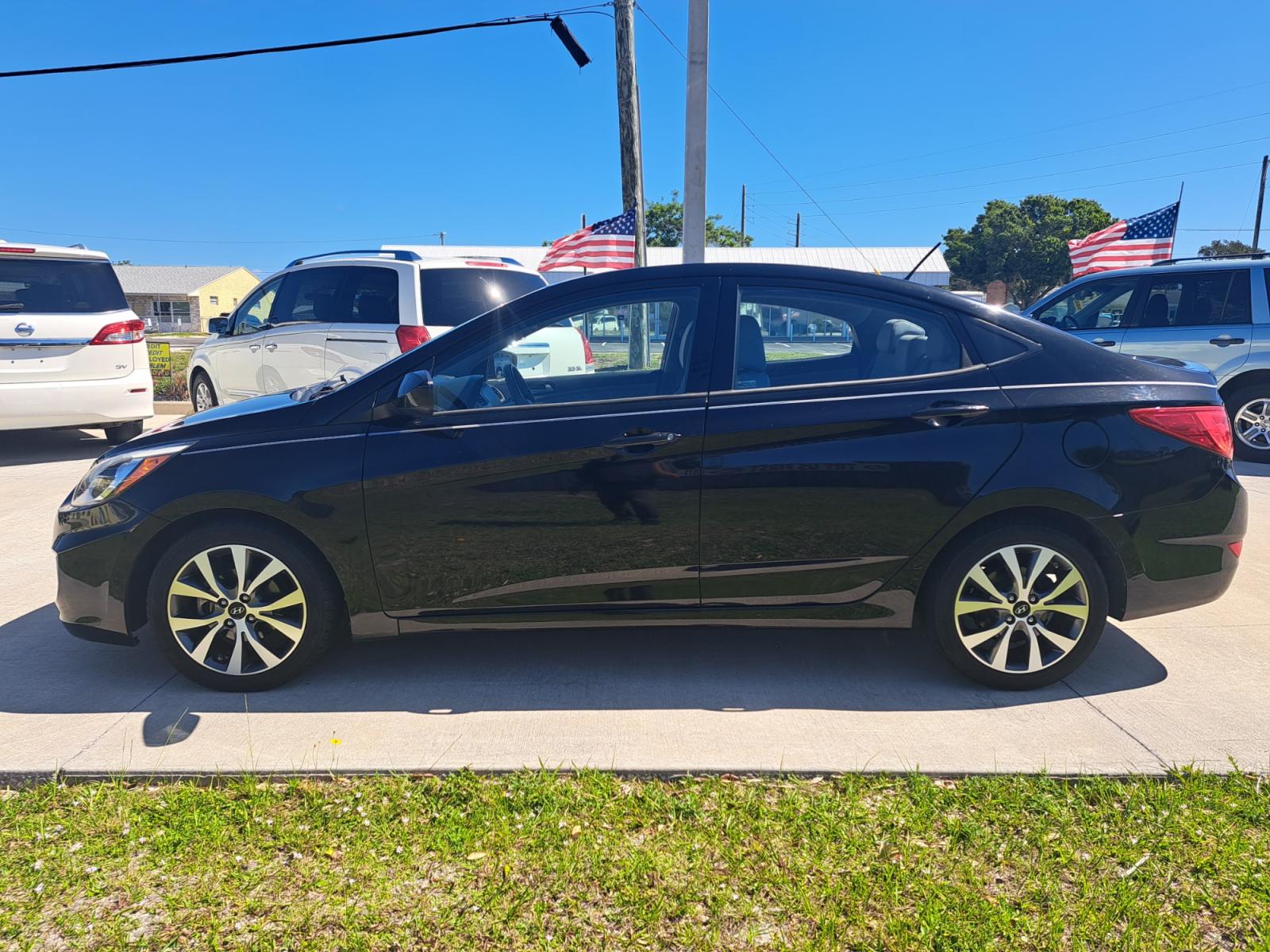 2017 Black Hyundai Accent SE 4-Door 6M (KMHCT4AE2HU) with an 1.6L L4 DOHC 16V engine, Automatic transmission, located at 1181 Aurora Rd, Melbourne, FL, 32935, (321) 241-1100, 28.132914, -80.639175 - Photo #0
