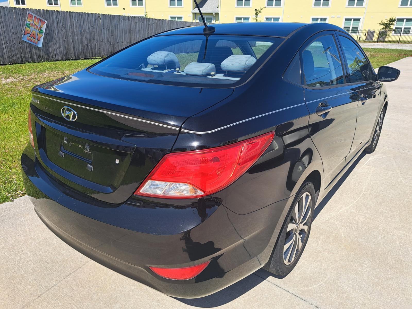 2017 Black Hyundai Accent SE 4-Door 6M (KMHCT4AE2HU) with an 1.6L L4 DOHC 16V engine, Automatic transmission, located at 1181 Aurora Rd, Melbourne, FL, 32935, (321) 241-1100, 28.132914, -80.639175 - Photo #1