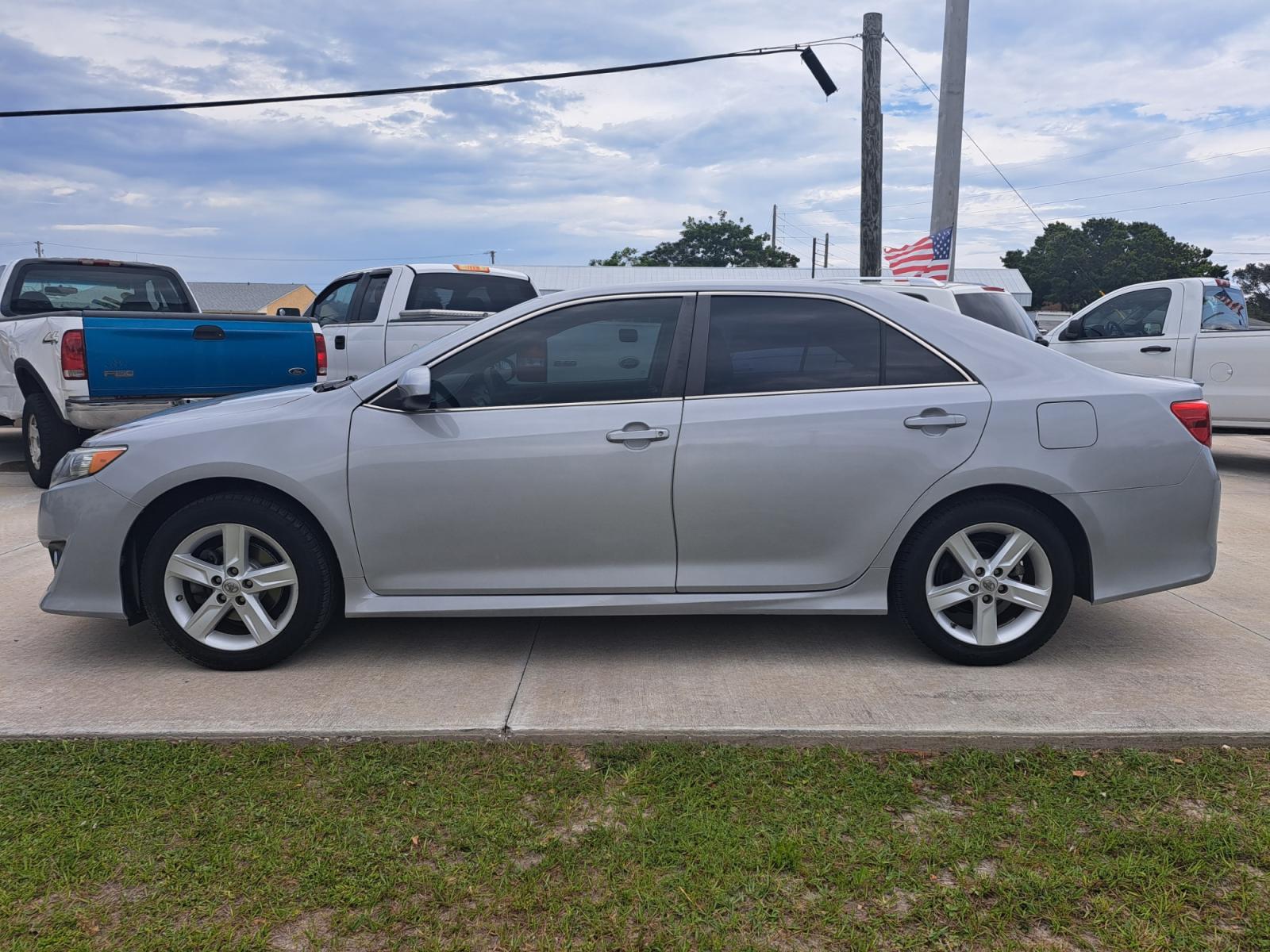 2014 Silver Toyota Camry SE (4T1BF1FK8EU) with an 2.5L L4 DOHC 16V engine, 6-Speed Automatic transmission, located at 1181 Aurora Rd, Melbourne, FL, 32935, (321) 241-1100, 28.132914, -80.639175 - Photo #0