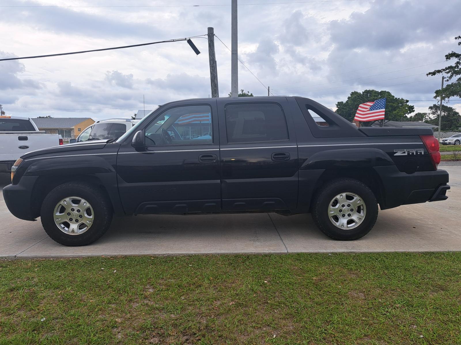 2002 Black Chevrolet Avalanche 1500 2WD (3GNEC13T02G) with an 5.3L V8 OHV 16V engine, 4-Speed Automatic Overdrive transmission, located at 1181 Aurora Rd, Melbourne, FL, 32935, (321) 241-1100, 28.132914, -80.639175 - Photo #0