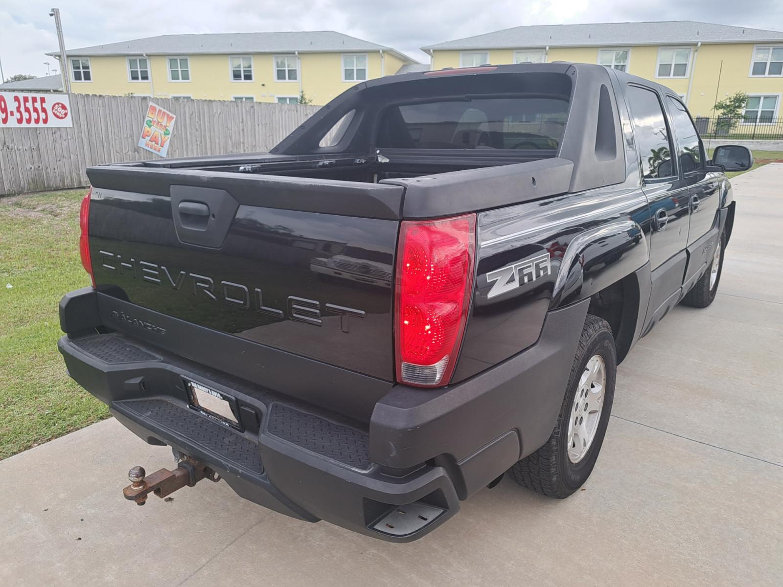 2002 Black Chevrolet Avalanche 1500 2WD (3GNEC13T02G) with an 5.3L V8 OHV 16V engine, 4-Speed Automatic Overdrive transmission, located at 1181 Aurora Rd, Melbourne, FL, 32935, (321) 241-1100, 28.132914, -80.639175 - Photo #1
