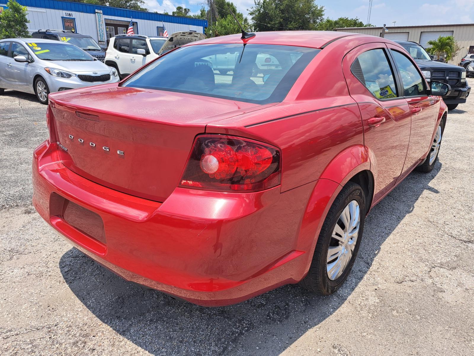 2014 RED Dodge Avenger SE (1C3CDZAB7EN) with an 2.4L L4 DOHC 16V engine, 4-Speed Automatic transmission, located at 1181 Aurora Rd, Melbourne, FL, 32935, (321) 241-1100, 28.132914, -80.639175 - Photo #1