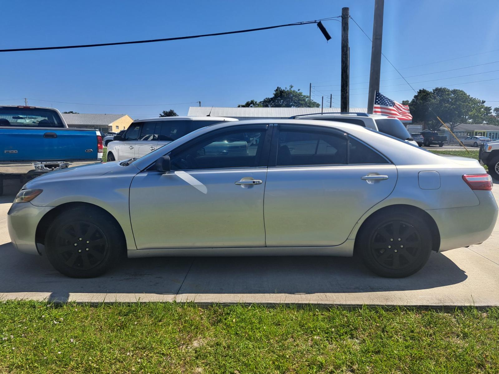 2007 Silver Toyota Camry LE V6 (4T1BK46K77U) with an 3.5L V6 DOHC 24V engine, 6-Speed Automatic Overdrive transmission, located at 1181 Aurora Rd, Melbourne, FL, 32935, (321) 241-1100, 28.132914, -80.639175 - Photo #0