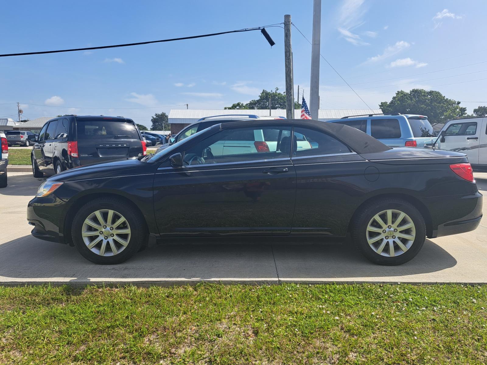2013 Black Chrysler 200 Touring Convertible (1C3BCBEB1DN) with an 2.4L L4 DOHC 16V engine, 6-Speed Automatic transmission, located at 1181 Aurora Rd, Melbourne, FL, 32935, (321) 241-1100, 28.132914, -80.639175 - Photo #0