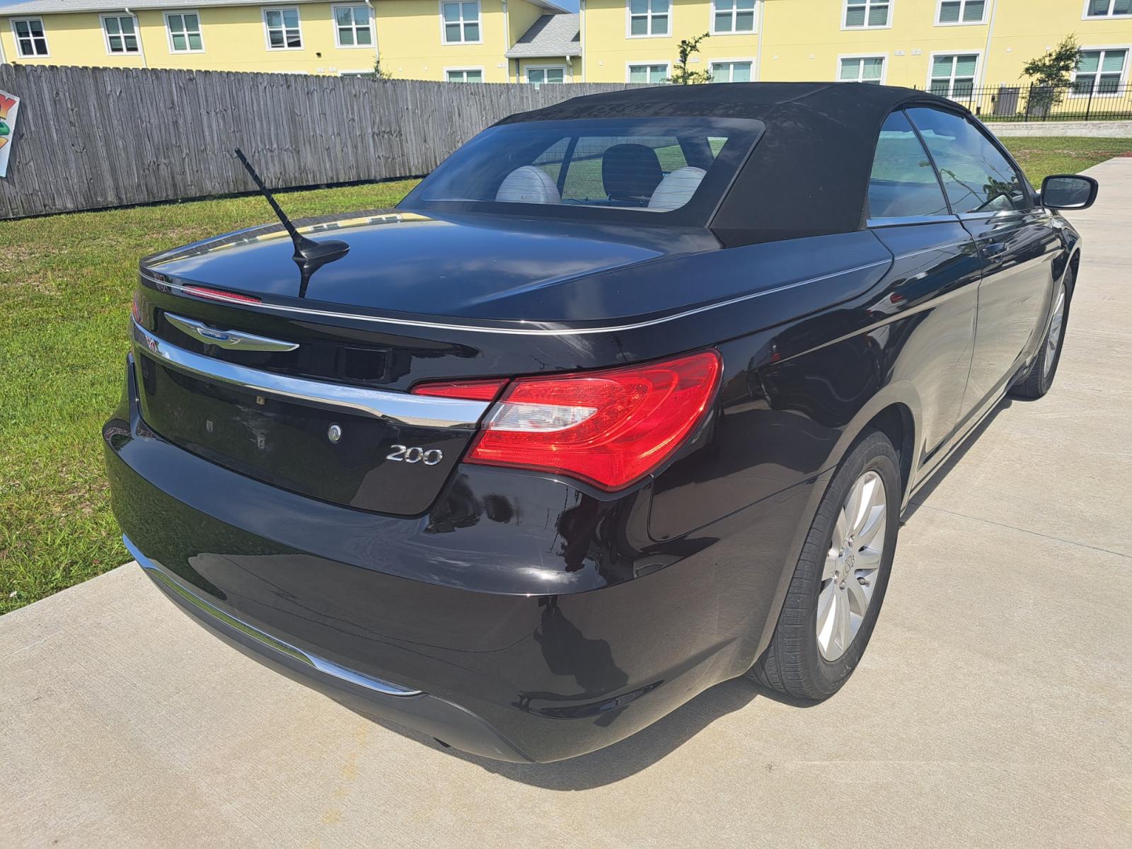 2013 Black Chrysler 200 Touring Convertible (1C3BCBEB1DN) with an 2.4L L4 DOHC 16V engine, 6-Speed Automatic transmission, located at 1181 Aurora Rd, Melbourne, FL, 32935, (321) 241-1100, 28.132914, -80.639175 - Photo #1
