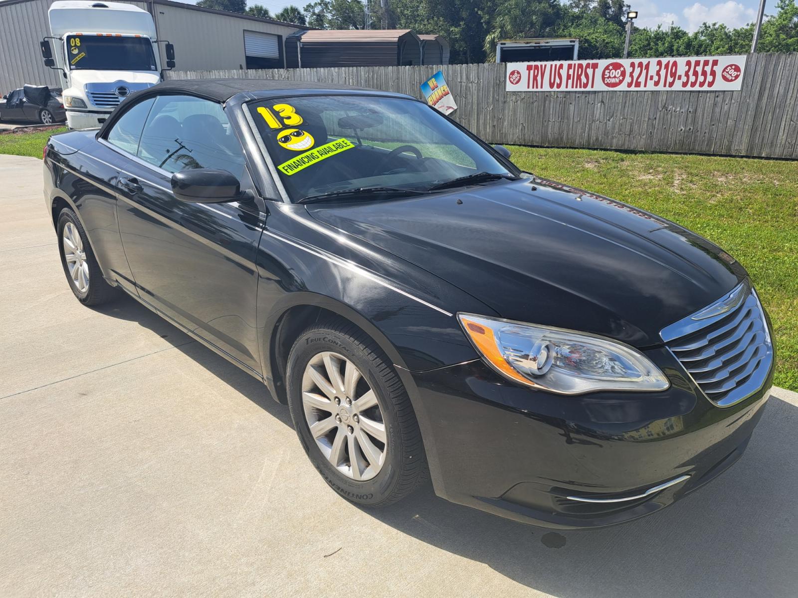 2013 Black Chrysler 200 Touring Convertible (1C3BCBEB1DN) with an 2.4L L4 DOHC 16V engine, 6-Speed Automatic transmission, located at 1181 Aurora Rd, Melbourne, FL, 32935, (321) 241-1100, 28.132914, -80.639175 - Photo #2