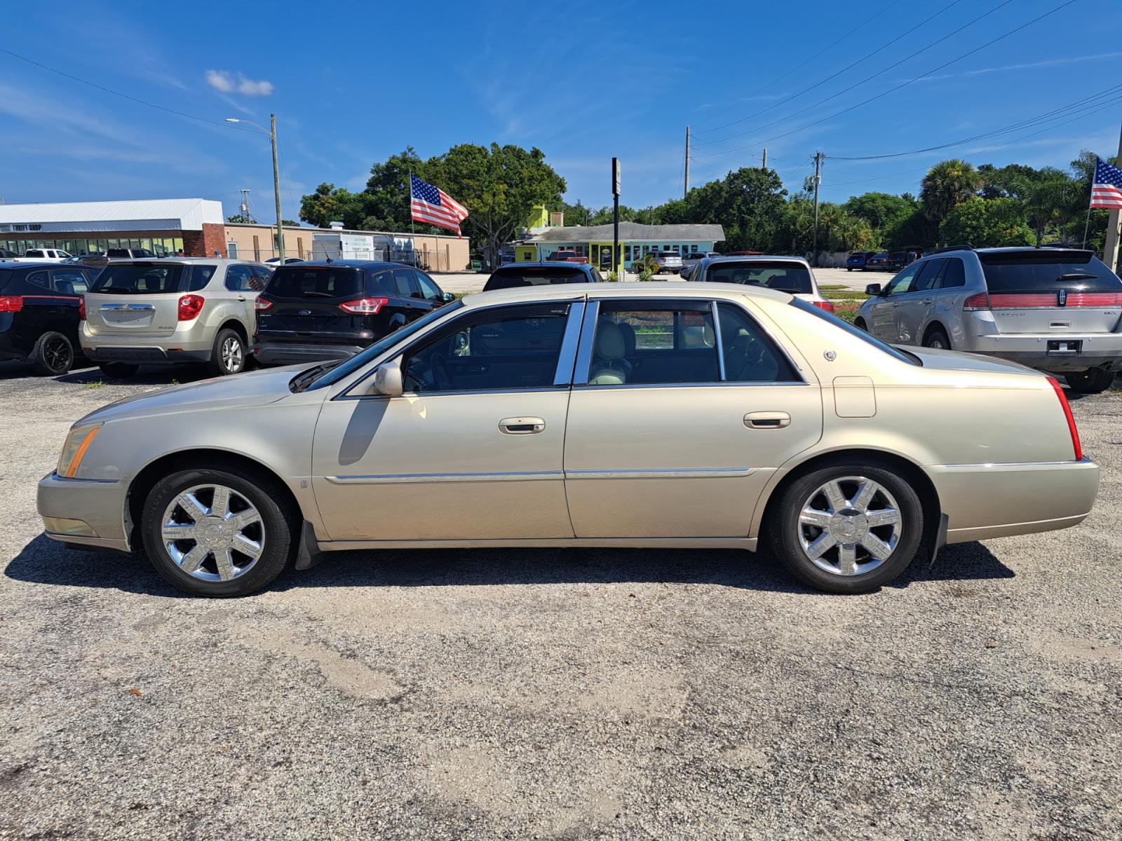2007 Gold Cadillac DTS Luxury 1 (1G6KD57Y37U) with an 4.6L V8 DOHC 32V engine, 4-Speed Automatic Overdrive transmission, located at 1181 Aurora Rd, Melbourne, FL, 32935, (321) 241-1100, 28.132914, -80.639175 - Photo #0