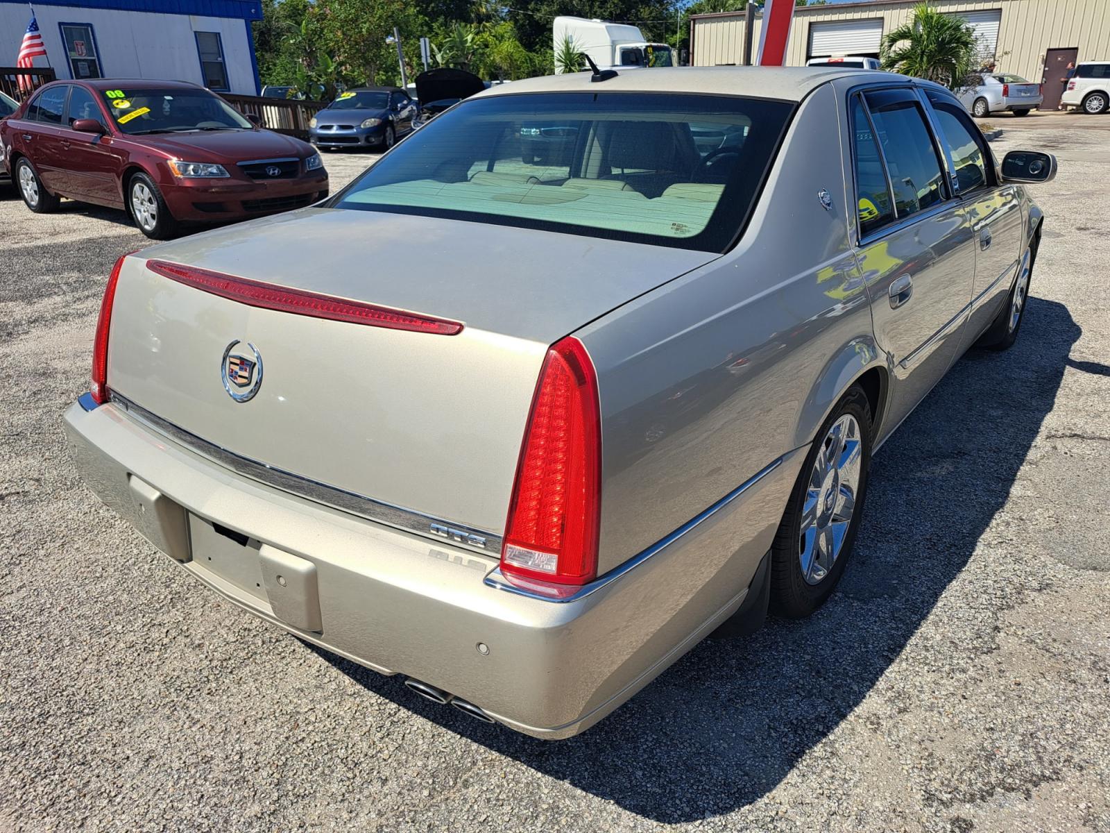 2007 Gold Cadillac DTS Luxury 1 (1G6KD57Y37U) with an 4.6L V8 DOHC 32V engine, 4-Speed Automatic Overdrive transmission, located at 1181 Aurora Rd, Melbourne, FL, 32935, (321) 241-1100, 28.132914, -80.639175 - Photo #1