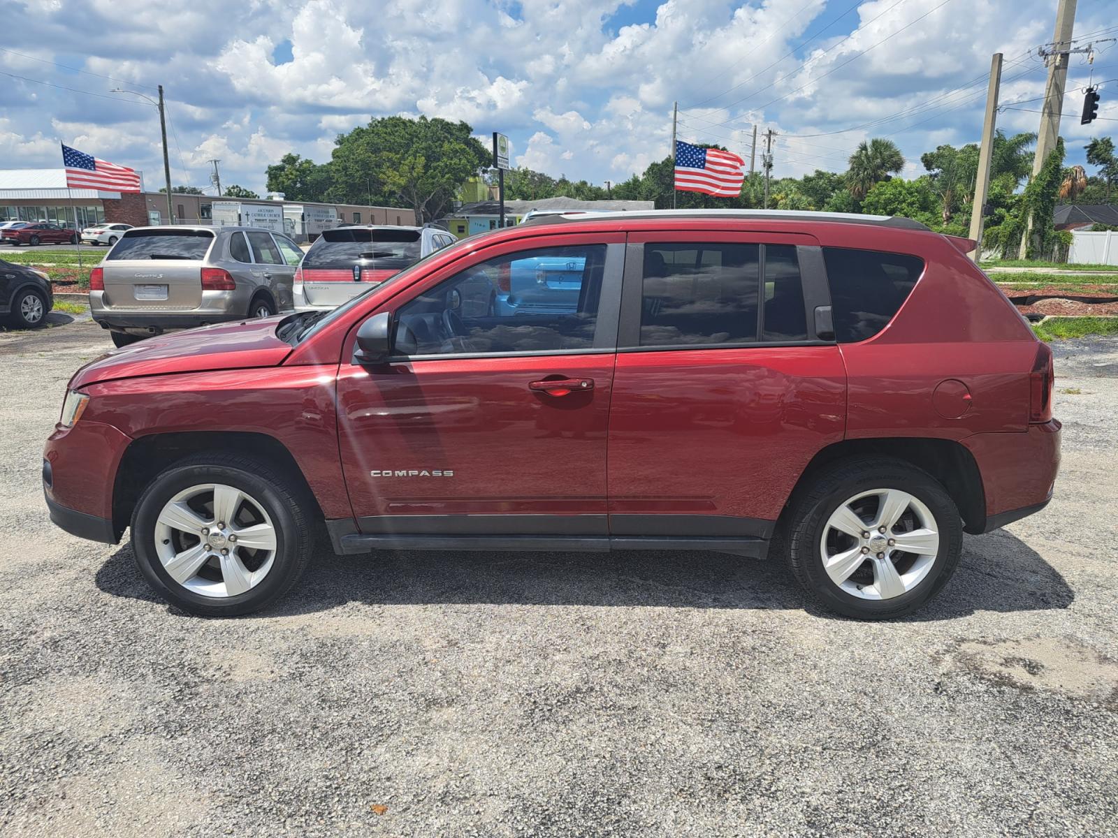 2016 RED Jeep Compass Latitude 4WD (1C4NJDEB4GD) with an 2.4L L4 DOHC 16V engine, 6A transmission, located at 1181 Aurora Rd, Melbourne, FL, 32935, (321) 241-1100, 28.132914, -80.639175 - Photo #0