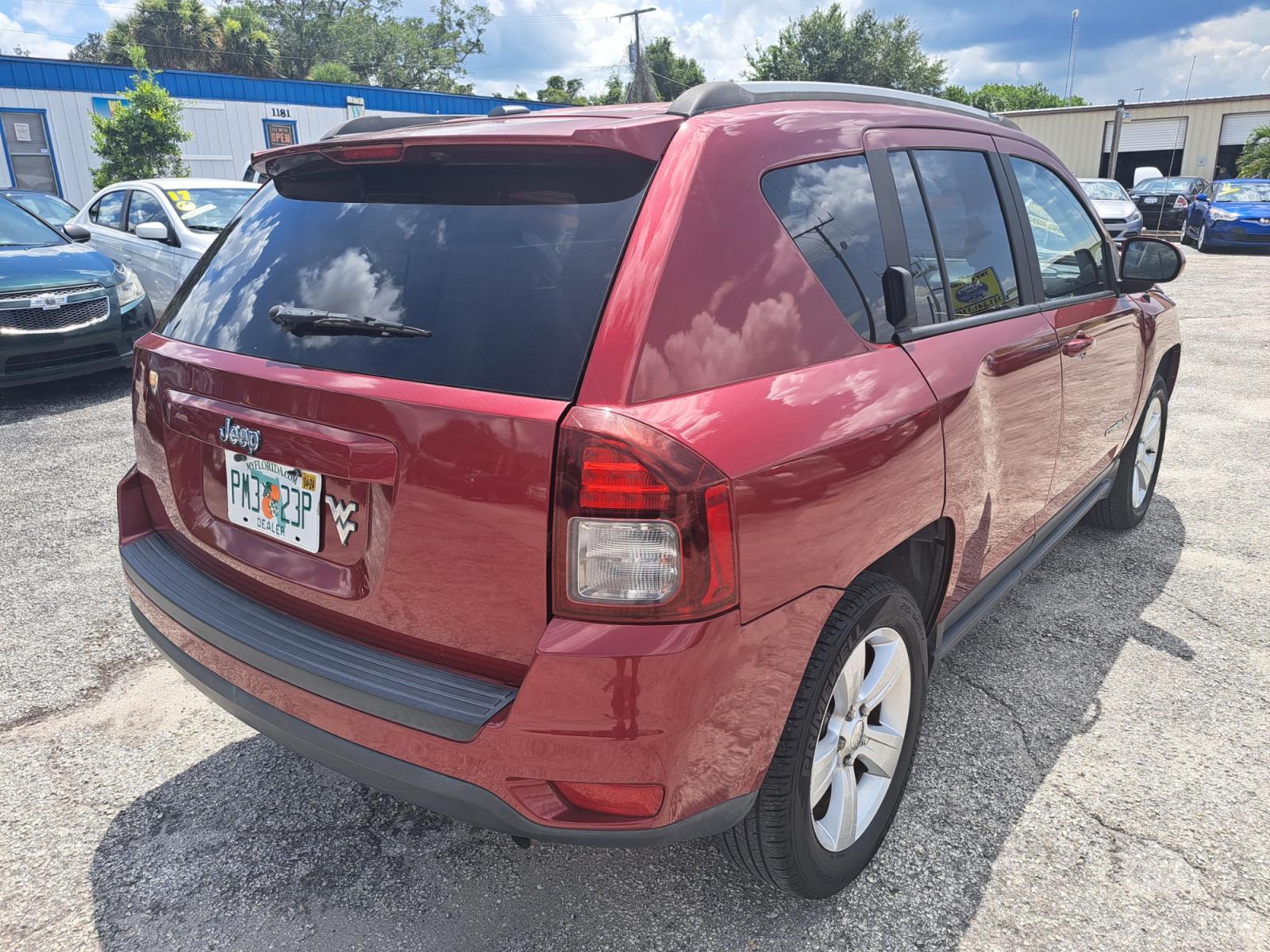2016 RED Jeep Compass Latitude 4WD (1C4NJDEB4GD) with an 2.4L L4 DOHC 16V engine, 6A transmission, located at 1181 Aurora Rd, Melbourne, FL, 32935, (321) 241-1100, 28.132914, -80.639175 - Photo #1