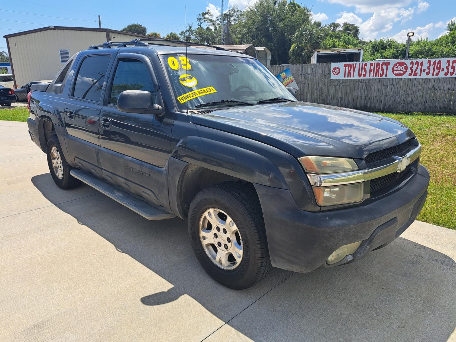 2003 Black Chevrolet Avalanche 1500 4WD (3GNEK13T03G) with an 5.3L V8 OHV 16V engine, 4-Speed Automatic Overdrive transmission, located at 1181 Aurora Rd, Melbourne, FL, 32935, (321) 241-1100, 28.132914, -80.639175 - Photo #0